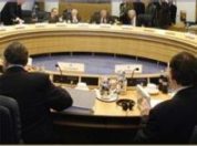 People seated around a large circular conference table